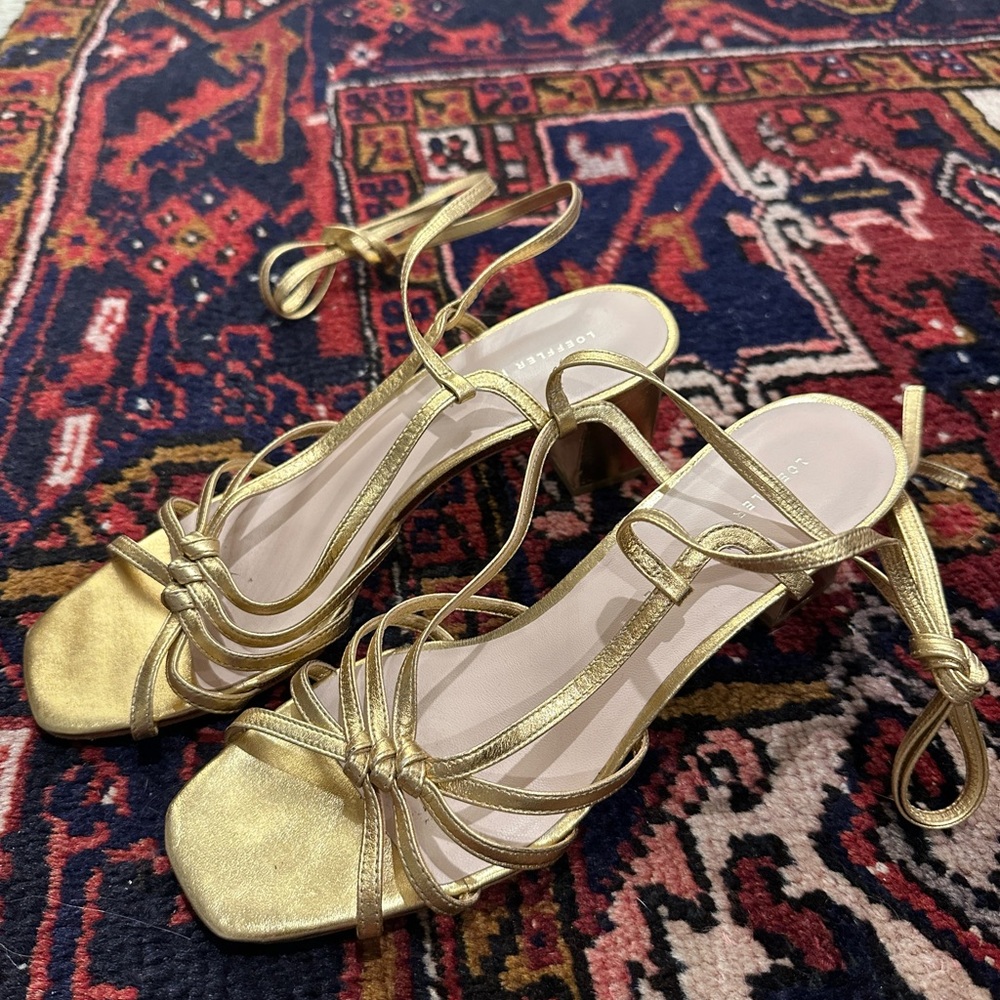 Fun gold ankle wrap sandals from Loeffler Randall. Size 8.
